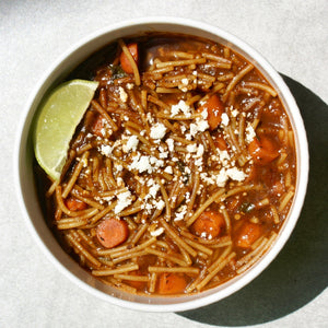 a bowl of birria fideo soup