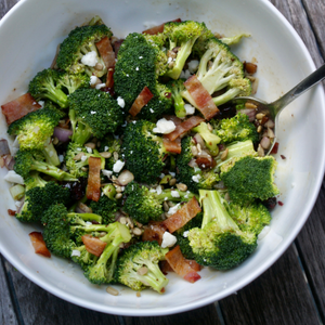 a bowl of broccoli salad with bacon vinaigrette